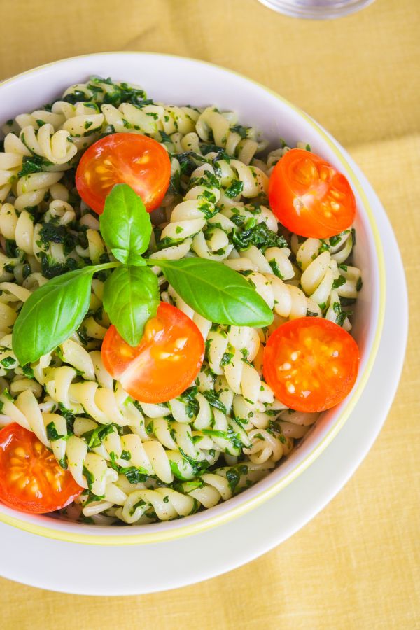 Pasta with spinach and cherry tomatoes.