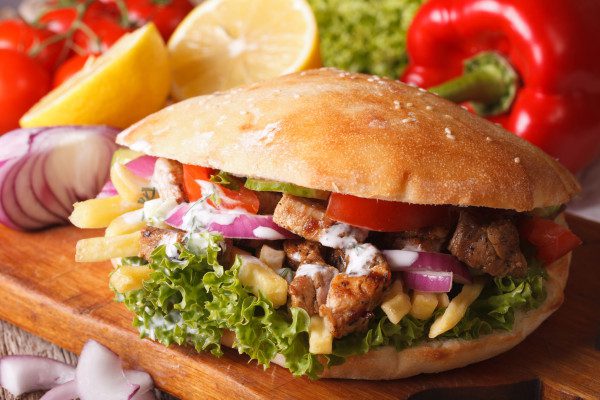 Doner kebab with meat and vegetables closeup. horizontal