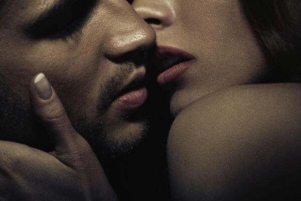 Photo of sensual kissing young couple