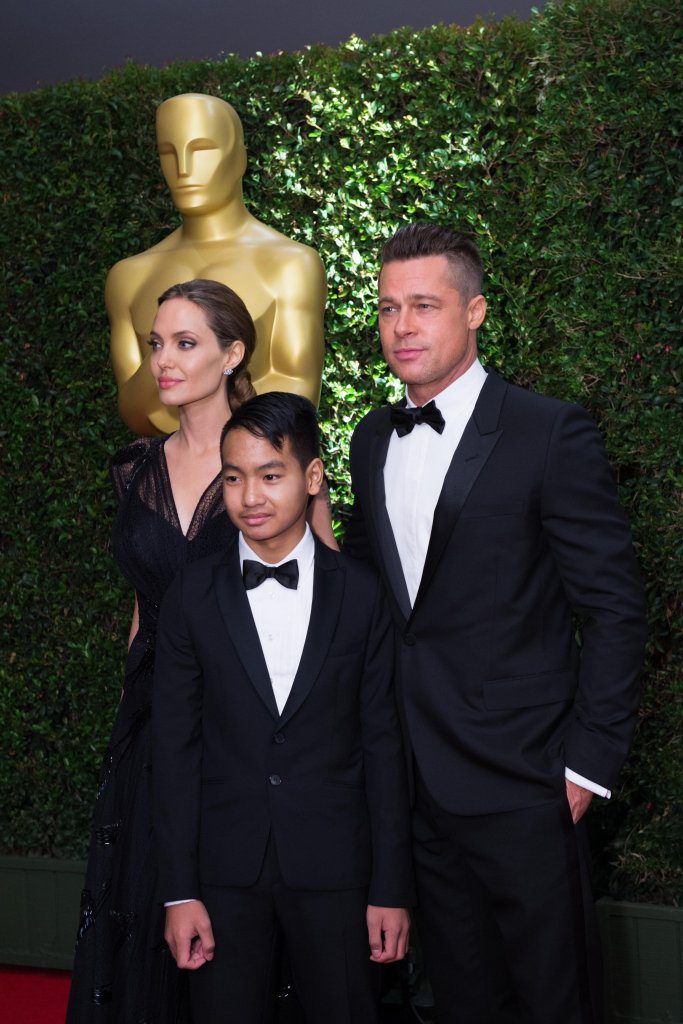 Jean Hersholt Humanitarian Award recipient Angelina Jolie (left), son Maddox Jolie-Pitt (center) and actor Brad Pitt attend the 5th Annual Governors Awards at The Ray Dolby Ballroom at Hollywood & Highland CenterÆ in Hollywood, CA, on Saturday, November 16, 2013.