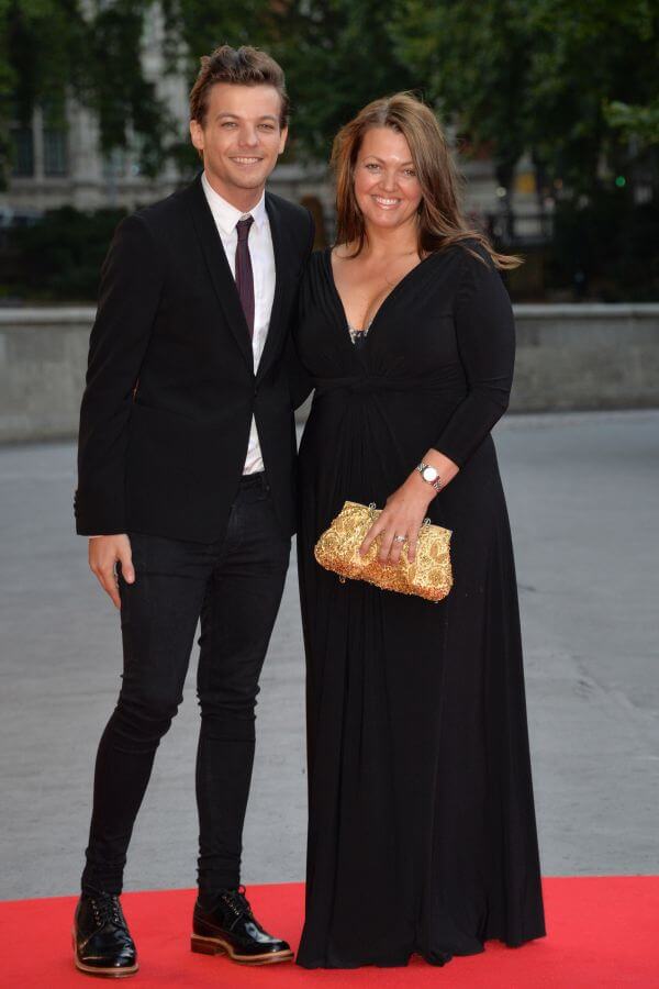 Louis Tomlinson and mother Johannah Deakin attends the Believe In Magic Cinderella Ball at the Natural History Museum in London, England. 10th August 2015. Photo by James Warren-Retna/PHOTOSHOT