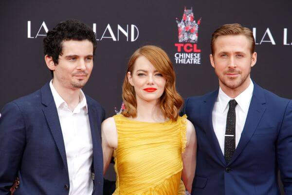 Director Damien Chazelle with Honorees Emma Stone and Ryan Gosling at their Hand and Footprint Ceremony held at the TCL Chinese Theater in Hollywood, CA, December 7, 2016. Photo by Joseph Martinez / PictureLux