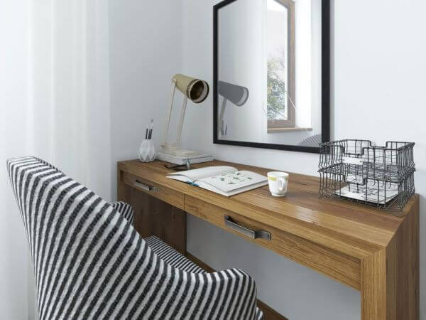Working space with a desk. Above the table hangs a mirror on the desk working papers and decor. Dressing table in the bedroom in the loft. 3D render.